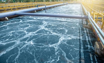 An aerial photo of some water catchment at a wastewater treatment plant.